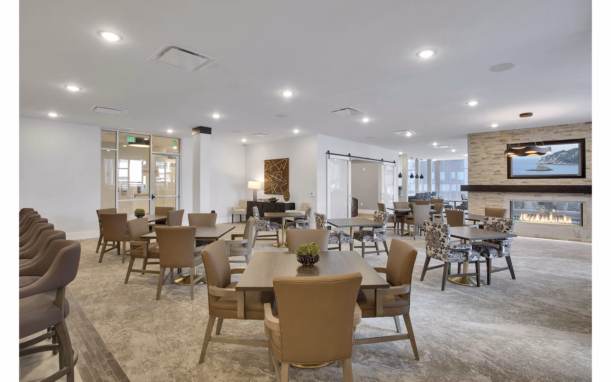 Clubhouse featuring modern design and cozy seating areas at Overture 9th + CO Apartments in luxury Greystar community