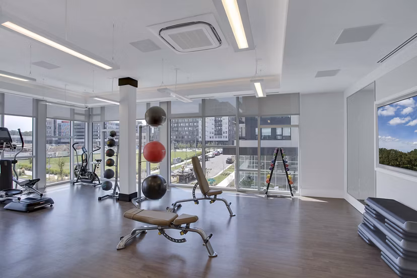 Modern fitness center with state-of-the-art equipment at Overture 9th + CO Apartments