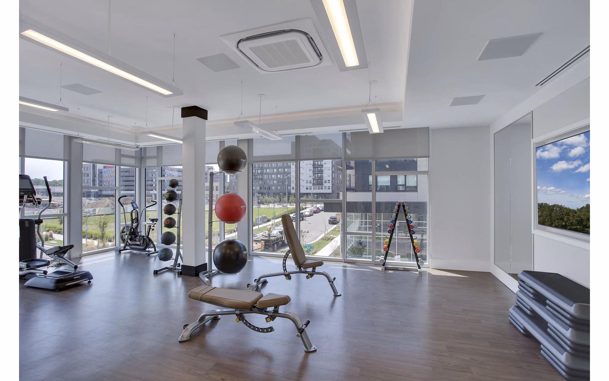 Modern fitness center with state-of-the-art equipment at Overture 9th + CO Apartments