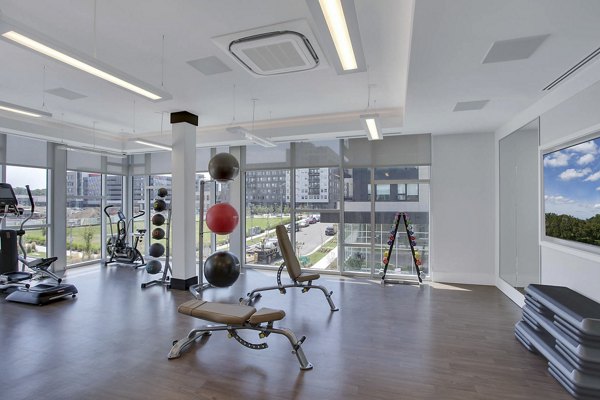 fitness center at Overture 9th + CO Apartments