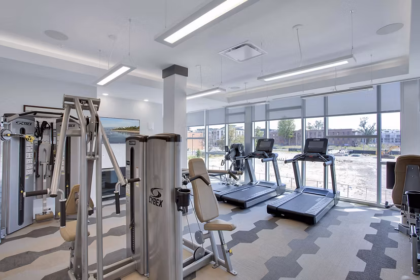 State-of-the-art fitness center featuring modern equipment at Overture 9th + CO Apartments