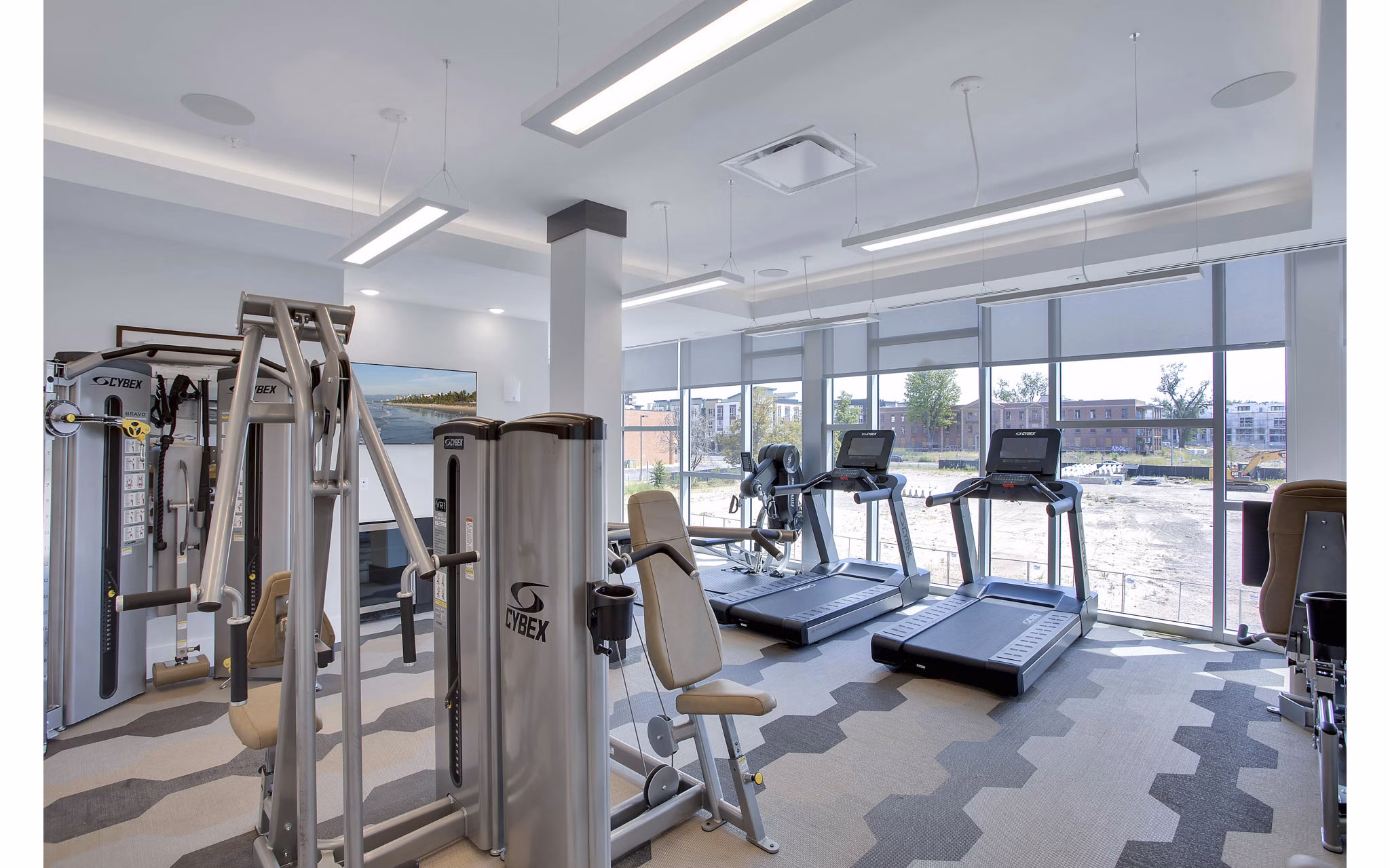 State-of-the-art fitness center featuring modern equipment at Overture 9th + CO Apartments