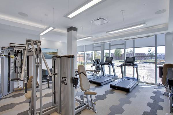 fitness center at Overture 9th + CO Apartments