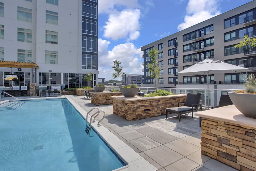 Rooftop pool offering city views at Overture 9th + CO Apartments