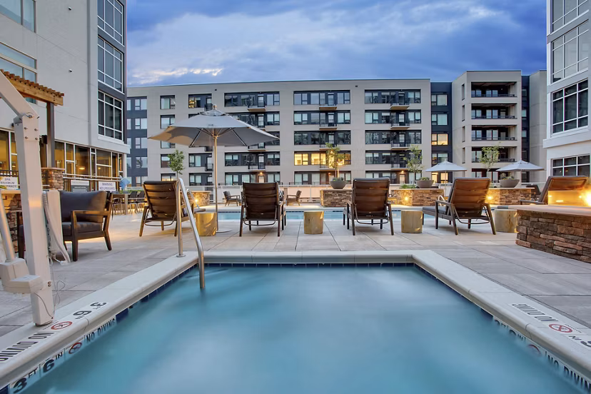 Rooftop pool with city skyline views at Overture 9th + CO luxury apartments