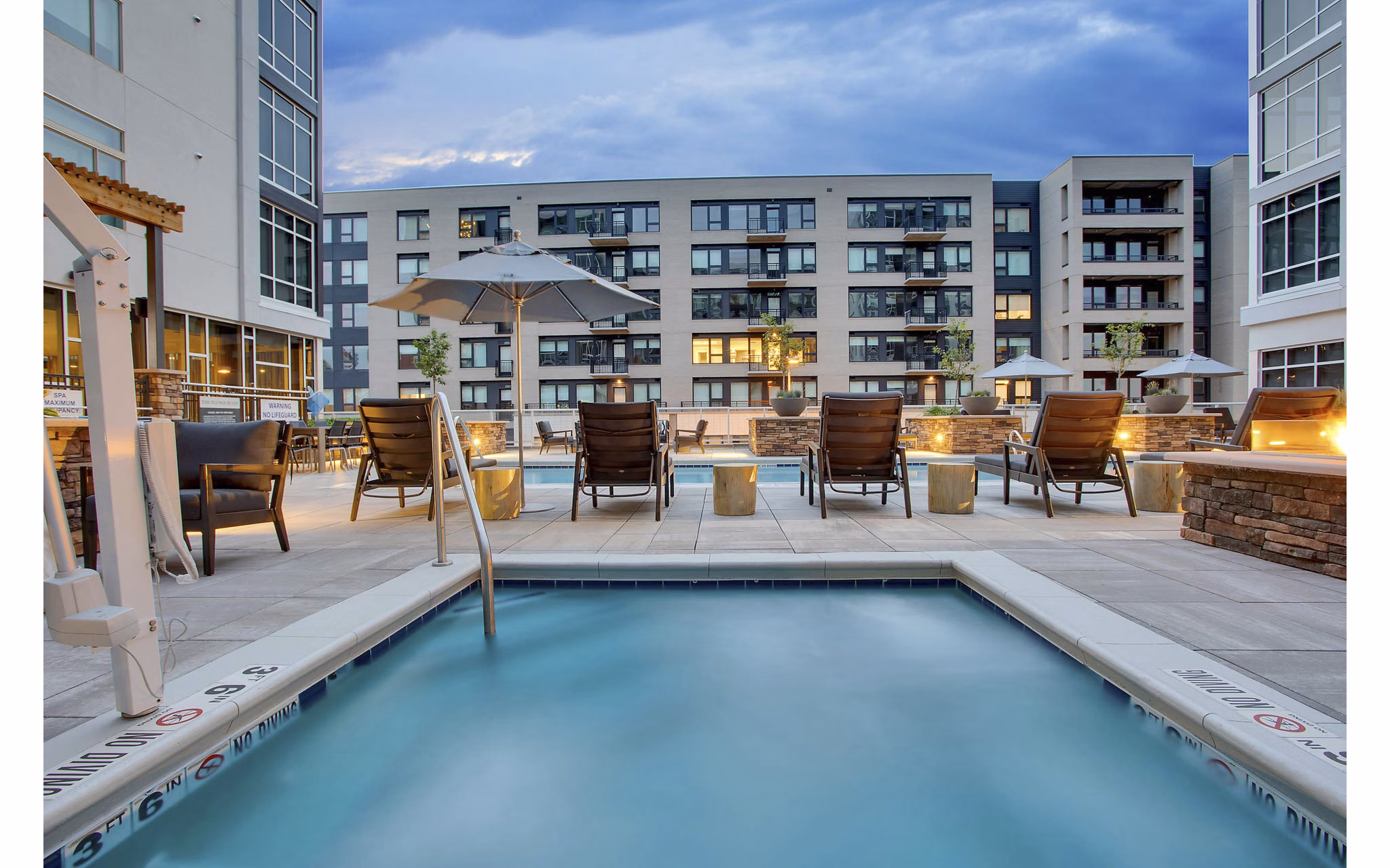 Rooftop pool with city skyline views at Overture 9th + CO luxury apartments