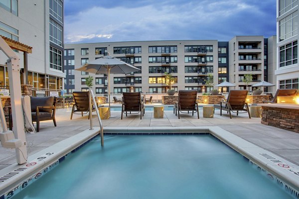 Rooftop pool with city skyline views at Overture 9th + CO luxury apartments