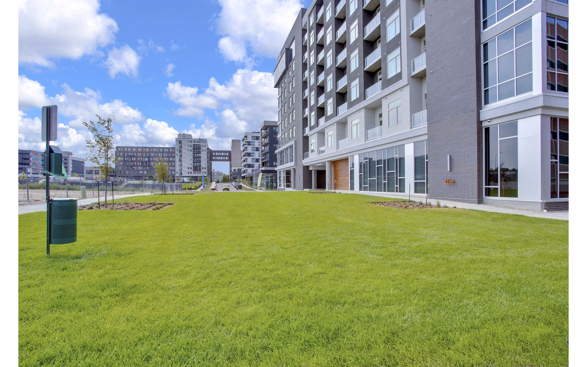 Dog-friendly park with agility equipment at Overture 9th + CO Apartments