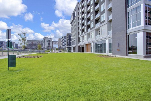 Dog-friendly park with agility equipment at Overture 9th + CO Apartments