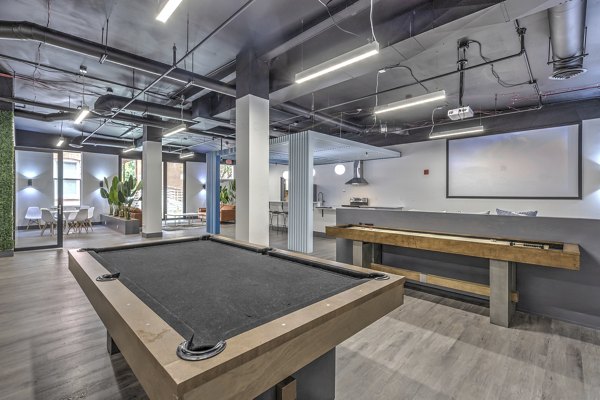 clubhouse game room at The Academy Apartments