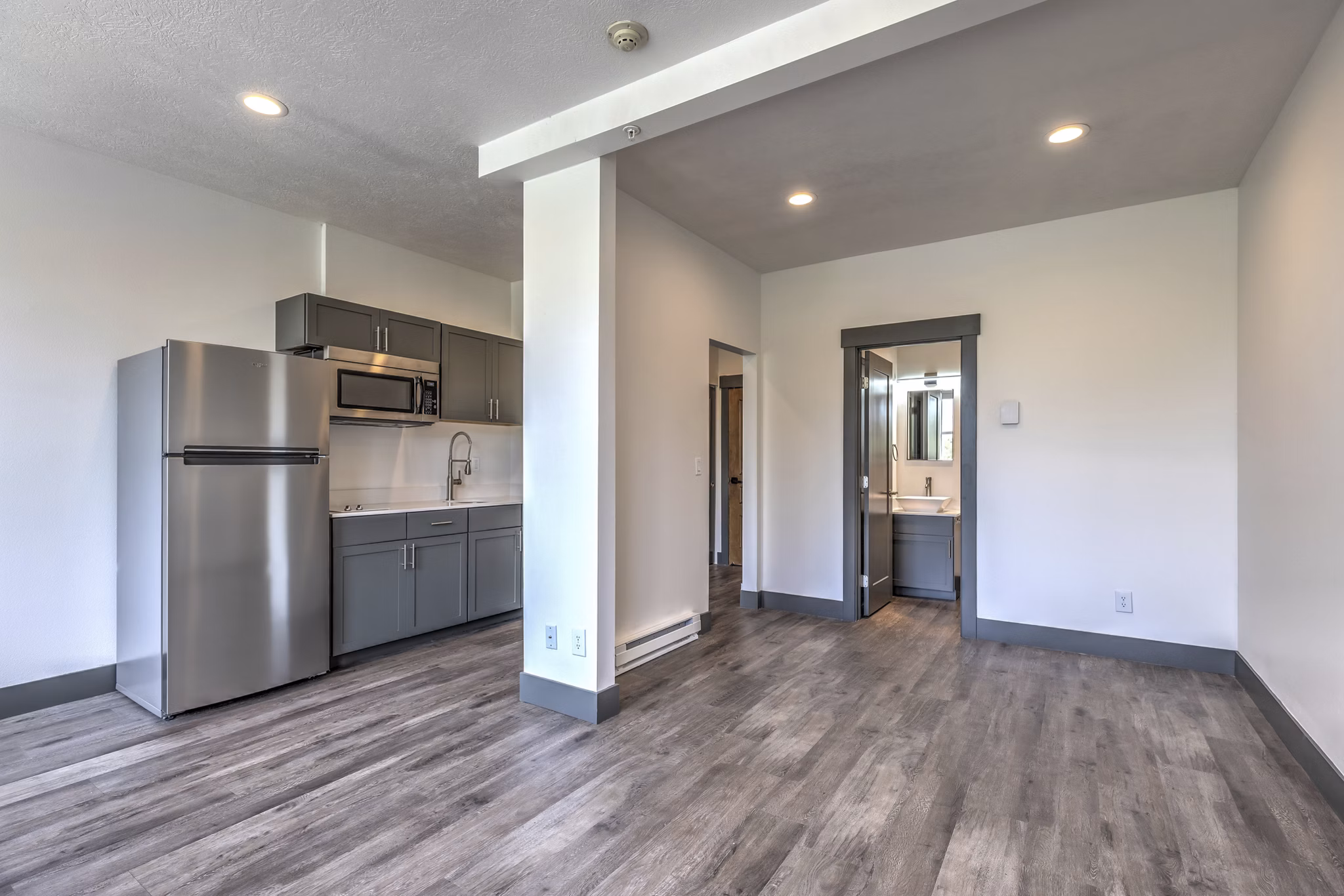 kitchen and living room at The Academy Apartments