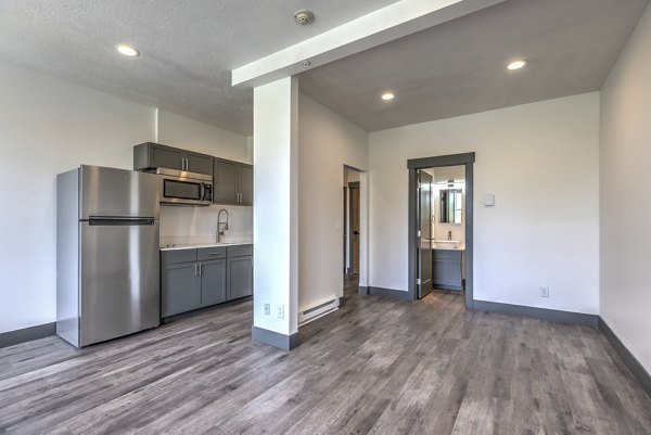 kitchen and living room at The Academy Apartments