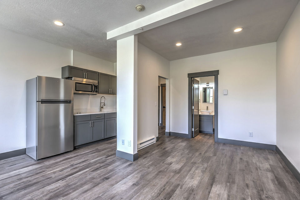 kitchen and living room at The Academy Apartments