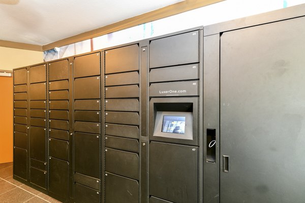 Mail room featuring secure mailboxes and package lockers at Avana on Main Apartments