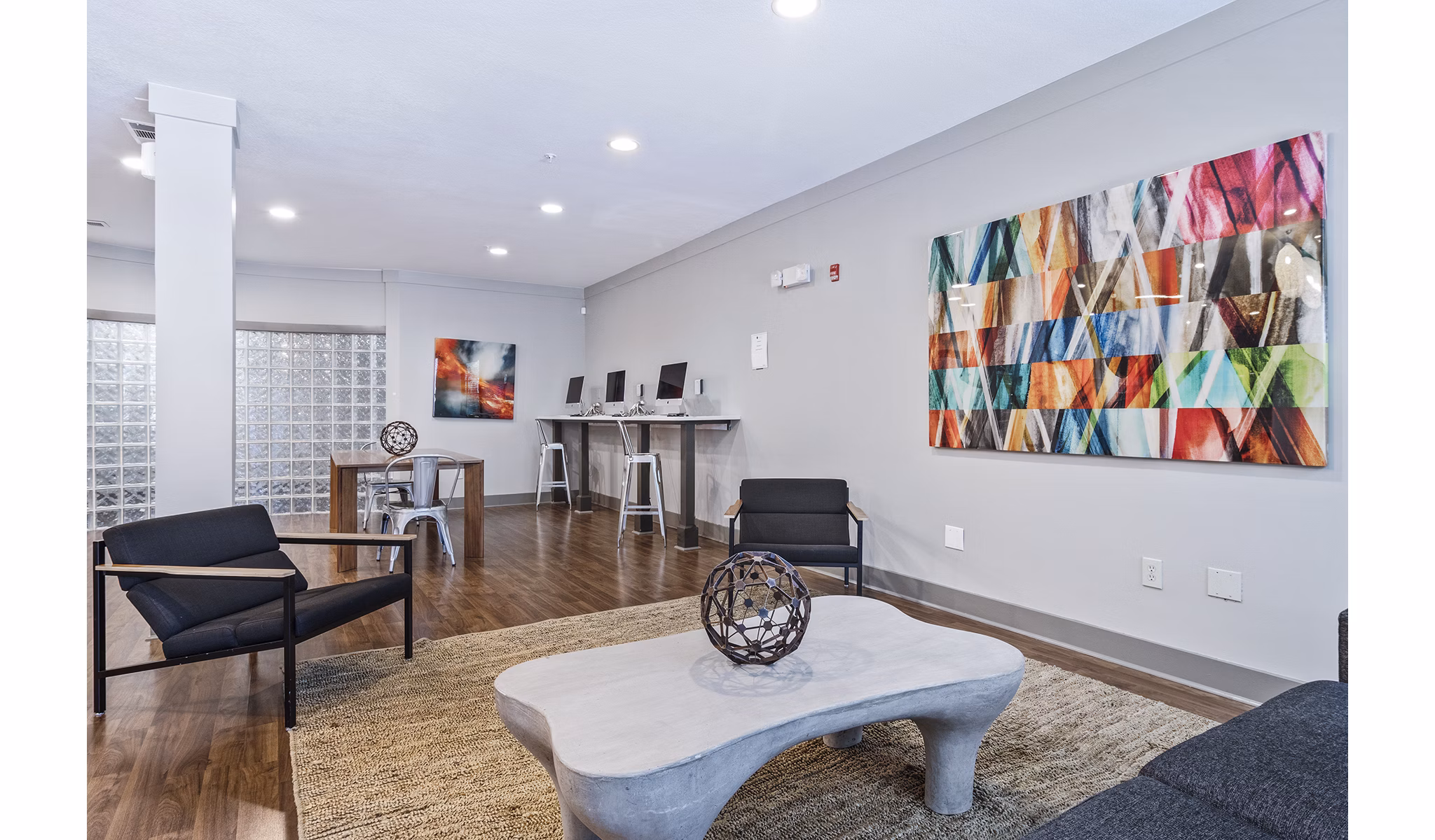 Clubhouse lobby with contemporary design and seating at Avana on Main Apartments