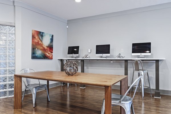 Business center with modern workstations at Avana on Main Apartments