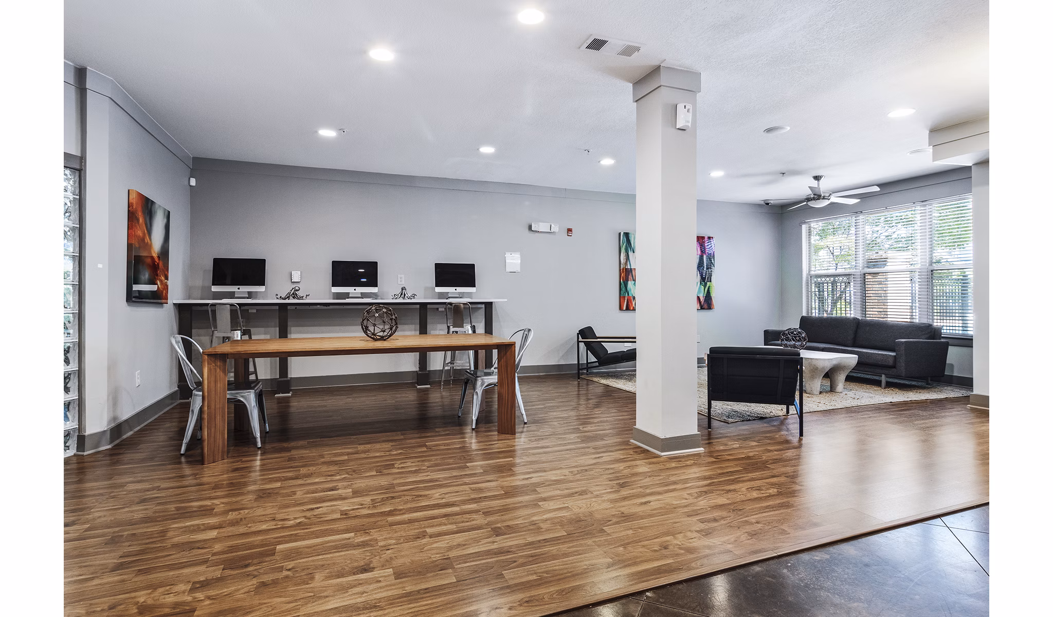 Modern business center with sleek workstations at Avana on Main Apartments