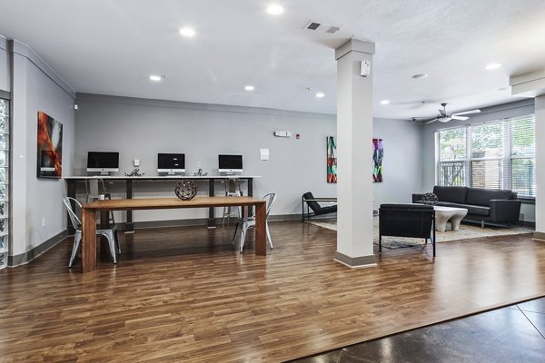 Modern business center with sleek workstations at Avana on Main Apartments