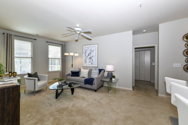 Spacious living room with contemporary design and natural light in Avana on Main Apartments