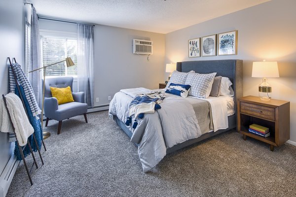 Cozy bedroom with soft lighting and modern decor at Avana Southview Apartments, offering luxury living in a prime location