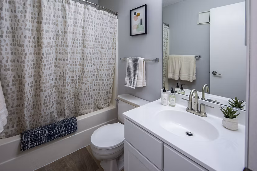 Modern bathroom with sleek fixtures and granite countertops in Avana Southview Apartments
