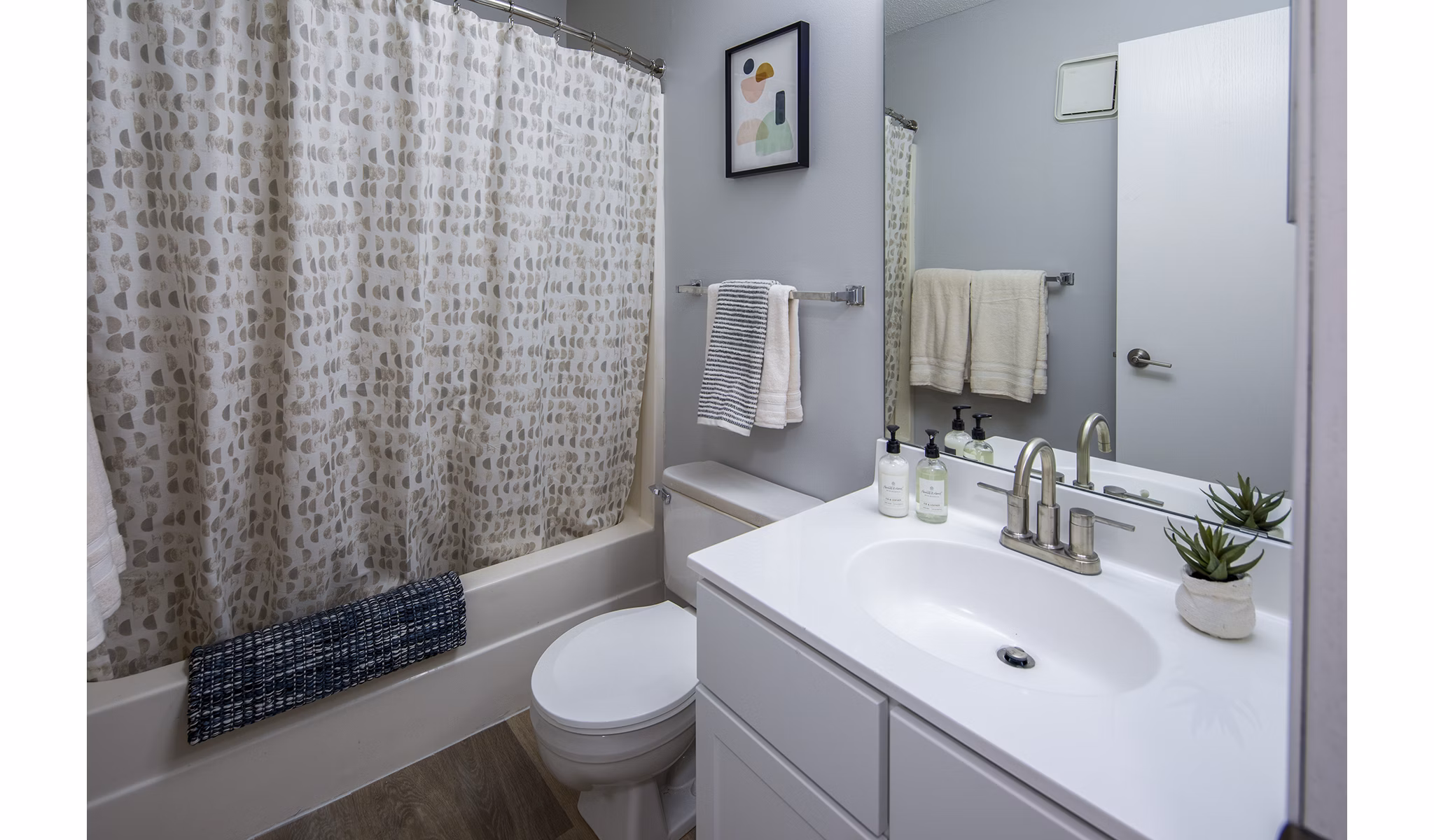 Modern bathroom with sleek fixtures and granite countertops in Avana Southview Apartments