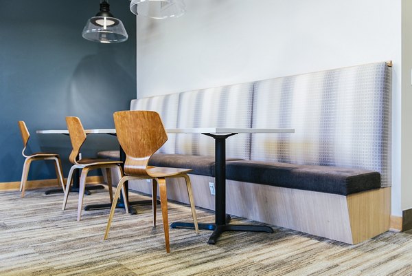 Contemporary clubhouse at Avana Southview Apartments featuring modern furnishings and spacious seating areas