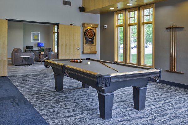 Game room featuring pool table and lounge seating at Avana Southview Apartments
