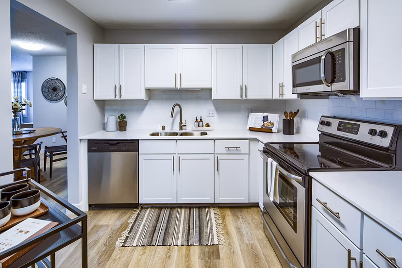 Contemporary kitchen with stainless steel appliances at Avana Southview Apartments, offering a luxury living experience