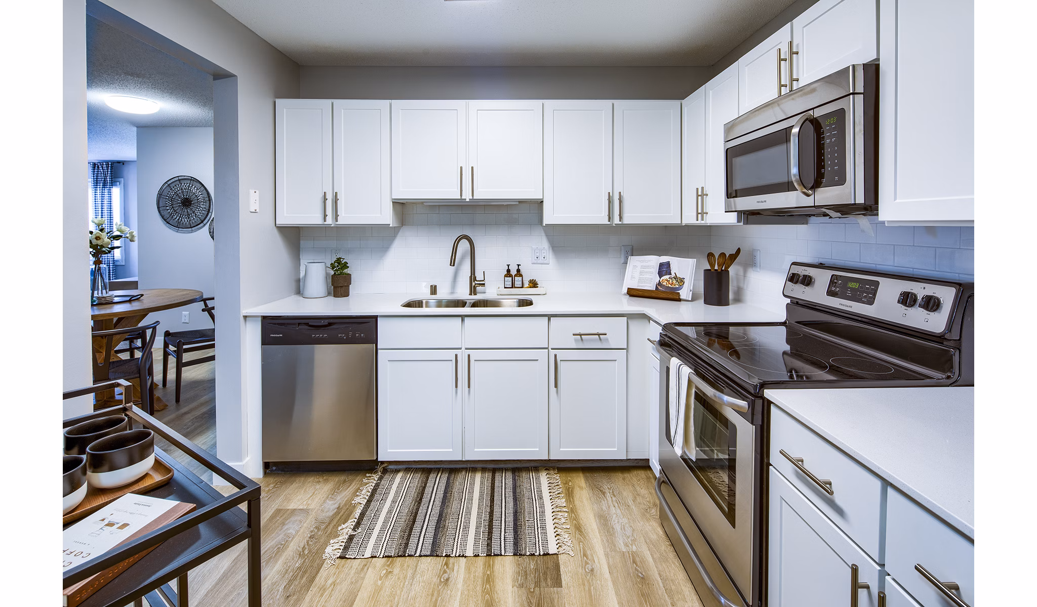 Contemporary kitchen with stainless steel appliances at Avana Southview Apartments, offering a luxury living experience