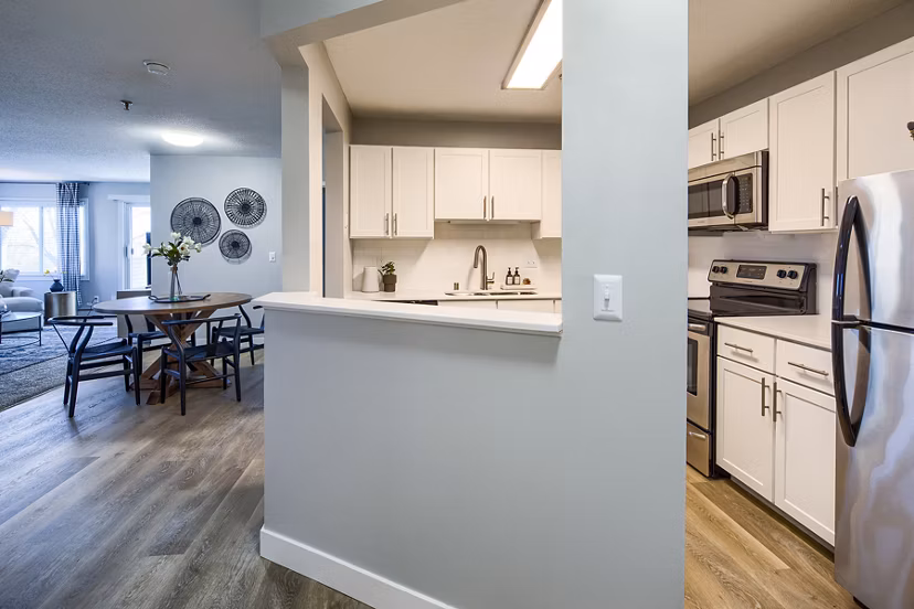 Modern kitchen with stainless steel appliances in Avana Southview Apartments, a Greystar luxury property