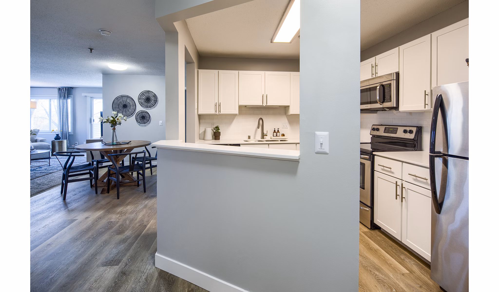 Modern kitchen with stainless steel appliances in Avana Southview Apartments, a Greystar luxury property