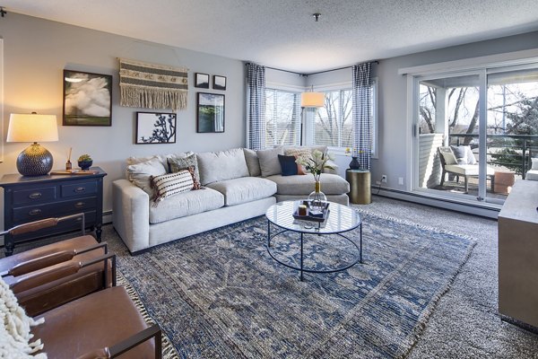 Spacious living room with designer furnishings in Avana Southview Apartments