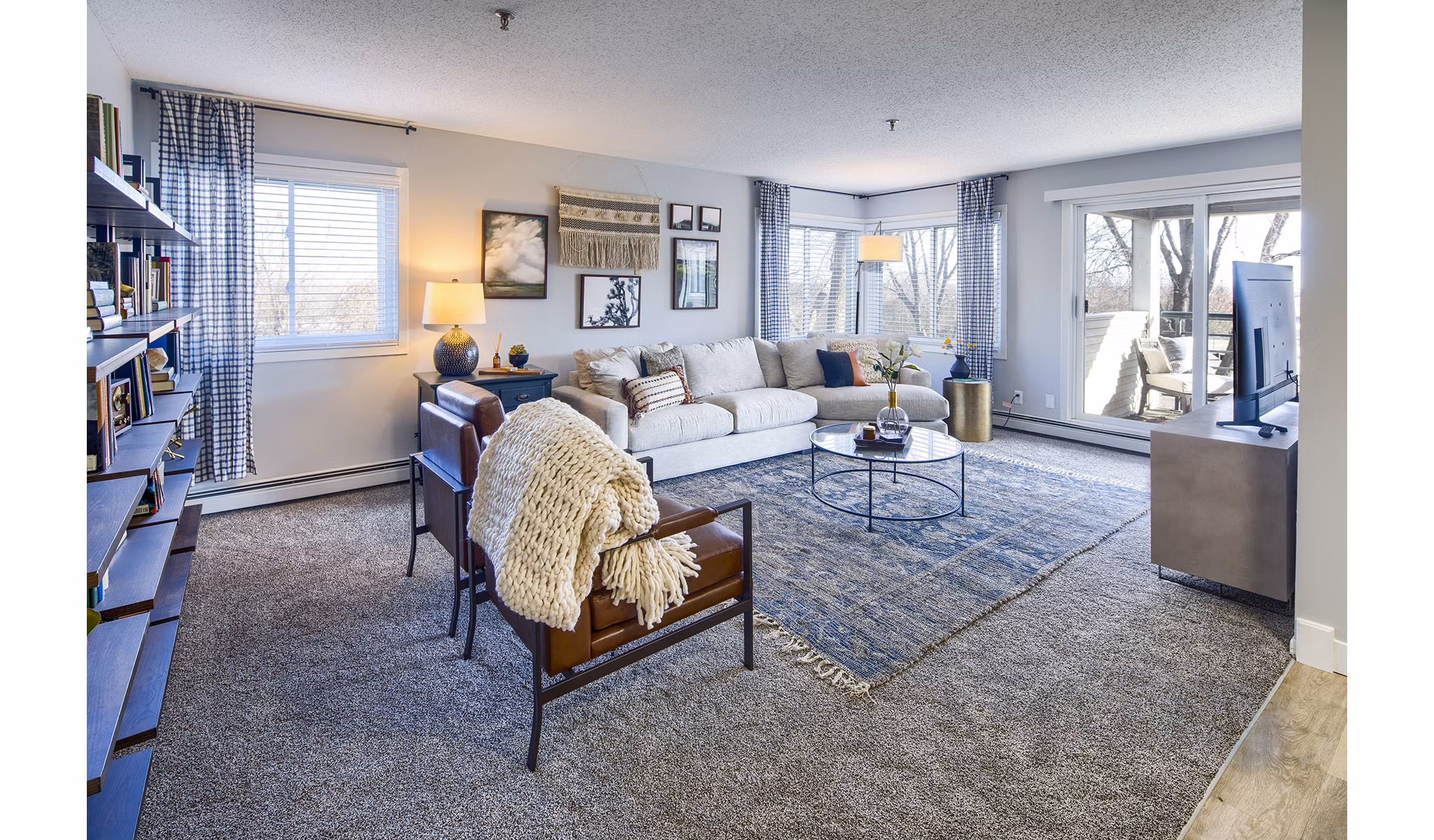 Contemporary living room with open layout and modern decor at Avana Southview Apartments
