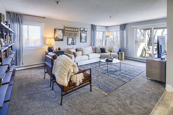 Contemporary living room with open layout and modern decor at Avana Southview Apartments