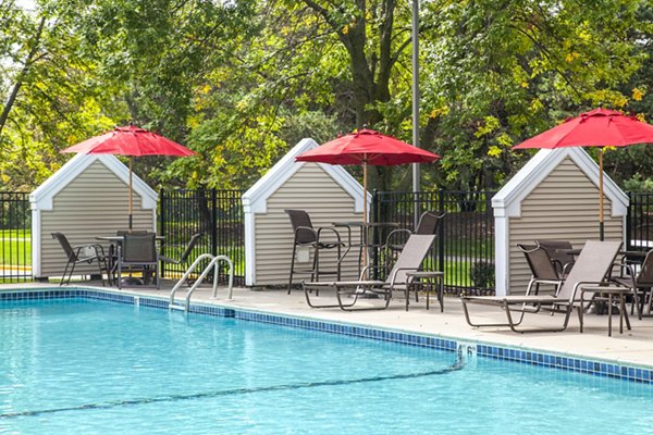 Outdoor pool area with sun loungers at Avana Southview Apartments offering resort-style relaxation