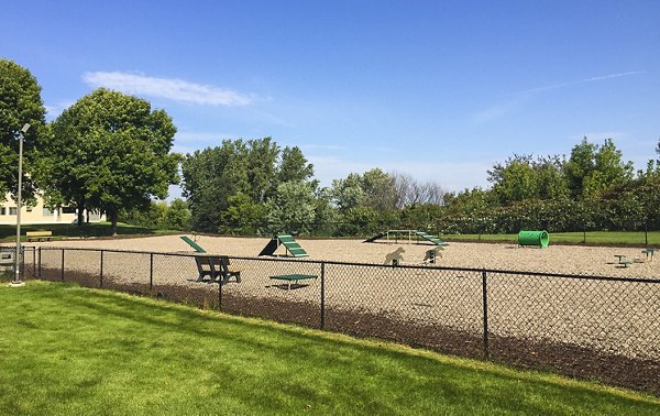 Dog park with agility equipment at Avana Southview Apartments, perfect for pet-friendly living in a welcoming community environment