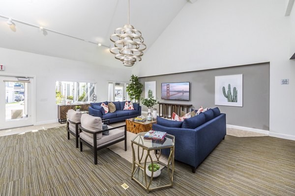 Modern clubhouse with cozy seating and entertainment area at Avana Springs Apartments