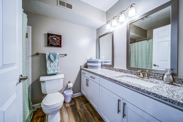 Bathroom featuring modern fixtures and sleek design at Autumn Woods Apartments