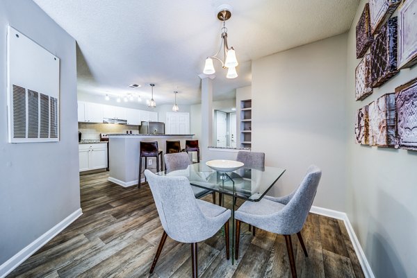 Dining room featuring elegant decor and modern furnishings at Autumn Woods Apartments, a luxurious living space offering comfort and style