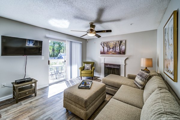 Spacious living room with elegant furnishings in Autumn Woods Apartments