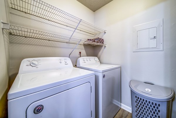 Laundry room with modern appliances at Autumn Woods Apartments, Greystar luxury apartments