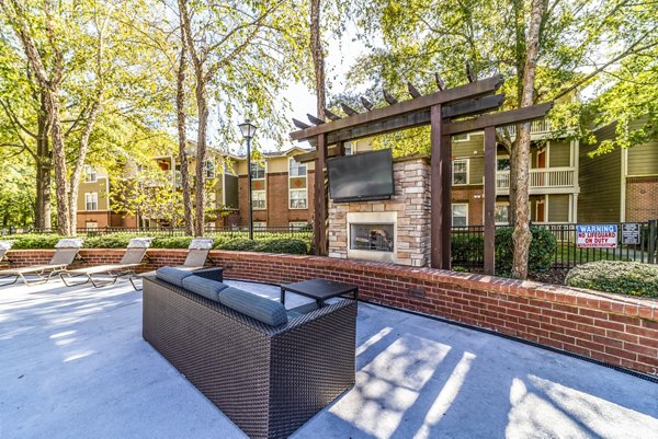 Cozy fire pit area on spacious patio at Autumn Woods Apartments