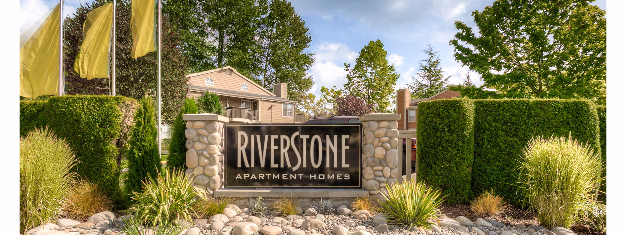 Riverstone Apartments: Signage indicating luxury living at premier residential community