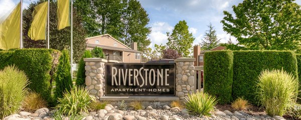 Riverstone Apartments: Signage indicating luxury living at premier residential community
