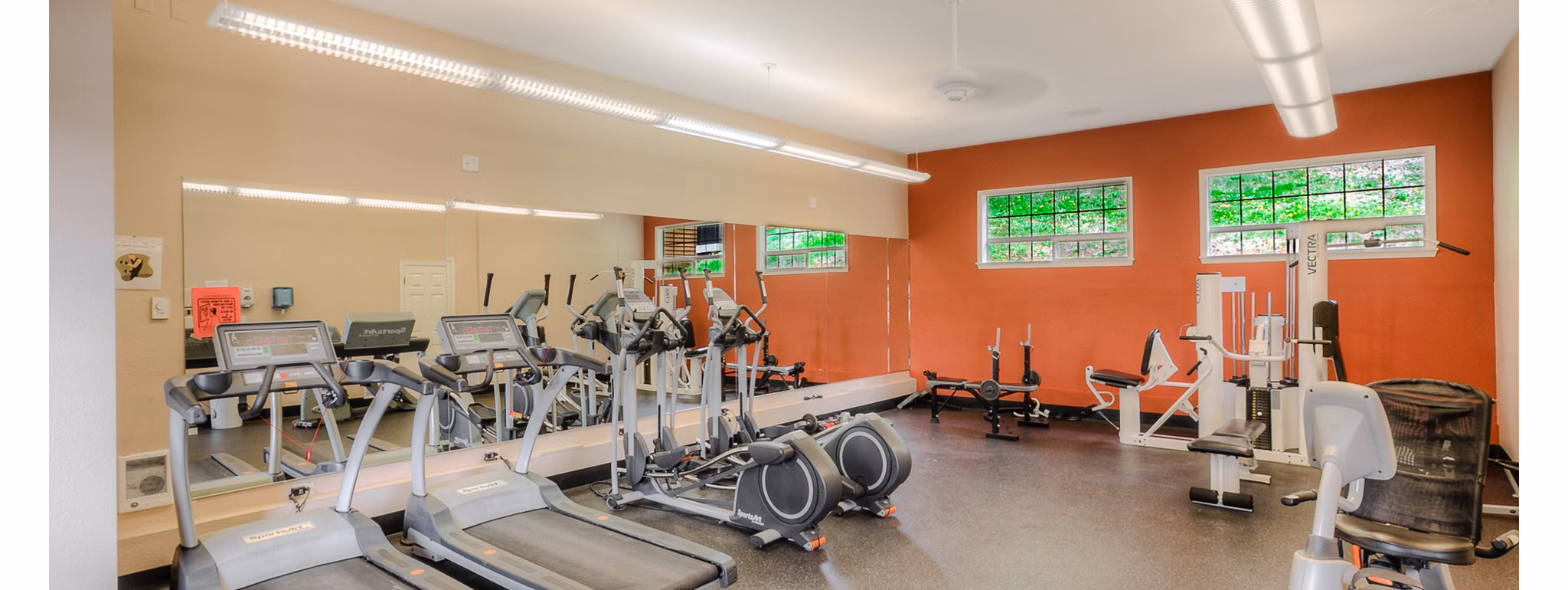 Modern fitness center with state-of-the-art equipment at Riverstone Apartments