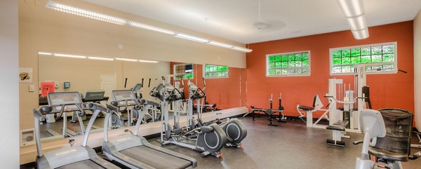 Modern fitness center with state-of-the-art equipment at Riverstone Apartments