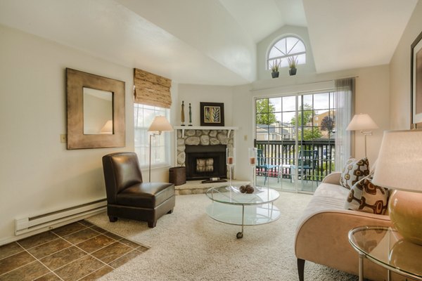 Spacious living room with modern furnishings at Riverstone Apartments
