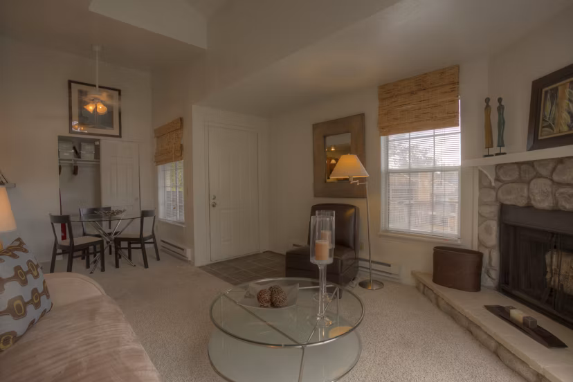 Bright living room with modern furnishings at Riverstone Apartments, luxury living space designed for comfort and style in urban surroundings