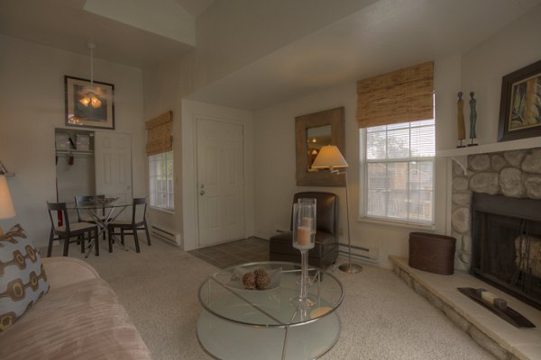 Bright living room with modern furnishings at Riverstone Apartments, luxury living space designed for comfort and style in urban surroundings